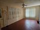 Spacious living room with durable flooring, neutral walls, and large windows at 420 W Crystal Dr, Sanford, FL 32773
