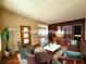 Staged living room featuring wood paneling, comfortable seating, and stylish decor at 420 W Crystal Dr, Sanford, FL 32773