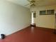 Spacious living room with durable flooring, neutral walls, and multiple access points at 420 W Crystal Dr, Sanford, FL 32773