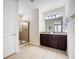 This bathroom features a glass shower and granite topped vanity at 431 Novi Path, Kissimmee, FL 34747