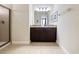 This bright bathroom features a glass shower and granite topped vanity at 431 Novi Path, Kissimmee, FL 34747