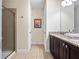 Bathroom features walk-in shower, tile floor, granite counters and a double vanity at 431 Novi Path, Kissimmee, FL 34747