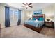 Bright bedroom features a king size bed with custom headboard and water-themed wall art at 431 Novi Path, Kissimmee, FL 34747