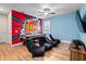 Colorful game room with a pool table, wall art, and comfortable seating at 431 Novi Path, Kissimmee, FL 34747