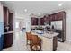Spacious kitchen with granite countertops, stainless steel appliances, and a breakfast bar with seating at 431 Novi Path, Kissimmee, FL 34747