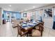 Open-concept living room and dining area with modern decor and ample natural light at 431 Novi Path, Kissimmee, FL 34747