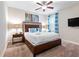 Primary bedroom with king bed, side tables and television at 431 Novi Path, Kissimmee, FL 34747
