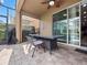 Covered patio with comfortable seating, offering a relaxing outdoor space for dining and lounging at 431 Novi Path, Kissimmee, FL 34747