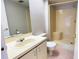 This bathroom features a standard shower stall, a sink, and a toilet at 4448 Pinebark Ave # 56-1, Orlando, FL 32811