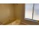 Bathroom with a tub/shower combination and a window for natural light at 4448 Pinebark Ave # 56-1, Orlando, FL 32811