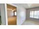 Bedroom with neutral walls, plush carpet, ceiling fan, and transom window at 4448 Pinebark Ave # 56-1, Orlando, FL 32811