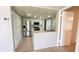 Bright kitchen featuring stainless steel appliances, tile flooring and white cabinetry at 4448 Pinebark Ave # 56-1, Orlando, FL 32811