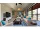 Bright living room featuring a ceiling fan, and a sliding glass door to the porch at 4448 Pinebark Ave # 56-1, Orlando, FL 32811