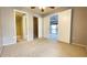 Spacious main bedroom with an ensuite bathroom, walk-in closet, and access to a screened balcony at 4448 Pinebark Ave # 56-1, Orlando, FL 32811