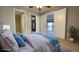 Spacious bedroom with en-suite bathroom, closet and view to the screened porch at 4448 Pinebark Ave # 56-1, Orlando, FL 32811