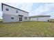 The spacious backyard is perfect for entertaining and features lush green grass at 4965 Kaia Ave, Winter Haven, FL 33884
