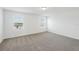 Bright bedroom with neutral carpet and two windows providing natural light to the interior space at 4965 Kaia Ave, Winter Haven, FL 33884