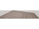 A close up of clean light brown carpet with white trim along the base of the wall at 4965 Kaia Ave, Winter Haven, FL 33884