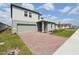 Attractive two-story home with a brick driveway and well-maintained landscaping at 4965 Kaia Ave, Winter Haven, FL 33884