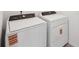 New laundry room area featuring a Whirlpool washer and dryer at 4965 Kaia Ave, Winter Haven, FL 33884
