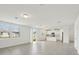 Bright, open-concept living space featuring tile flooring and sliding glass doors at 4965 Kaia Ave, Winter Haven, FL 33884