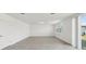 Spacious living area with tile flooring, connecting to the outdoor patio at 4965 Kaia Ave, Winter Haven, FL 33884