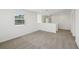 Open loft area with neutral carpet and bright light from the window creating a spacious feel at 4965 Kaia Ave, Winter Haven, FL 33884