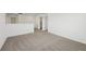 Bright loft area with neutral carpet for a clean and modern aesthetic at 4965 Kaia Ave, Winter Haven, FL 33884