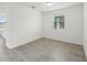 A brightly lit room with tile flooring and a large window at 4965 Kaia Ave, Winter Haven, FL 33884