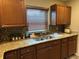 The kitchen features an undermount sink with granite countertop at 635 Kittredge Dr, Orlando, FL 32805