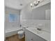 A traditional bathroom features a tub/shower combo, and a large vanity at 662 Lake Dr, Altamonte Springs, FL 32701