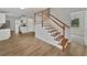 Inviting entryway with hardwood stairs, open concept kitchen, and neutral color palette for a modern feel at 662 Lake Dr, Altamonte Springs, FL 32701