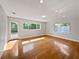 Bright living room with hardwood floors, recessed lighting, and large windows on a sunny day at 662 Lake Dr, Altamonte Springs, FL 32701