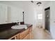 Bathroom features a single sink vanity with a window providing natural light at 6801 County Rd 665, Bushnell, FL 33513