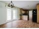 Spacious eat in kitchen provides wood floors and access to the back yard at 6801 County Rd 665, Bushnell, FL 33513