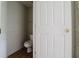 Picture inside the toilet room with a white door at 6801 County Rd 665, Bushnell, FL 33513