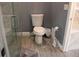 Bathroom with a shower and toilet and tile flooring at 9130 Laws Rd, Clermont, FL 34714