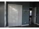 Bedroom view showcasing a spacious closet with folding doors and neutral-colored walls at 9130 Laws Rd, Clermont, FL 34714