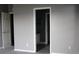 Bedroom with neutral walls and access to the bathroom at 9130 Laws Rd, Clermont, FL 34714