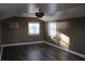Bonus room features new vinyl flooring, a ceiling fan, and two windows at 9130 Laws Rd, Clermont, FL 34714