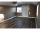 Bonus room features new vinyl flooring, a ceiling fan, three windows, and one door at 9130 Laws Rd, Clermont, FL 34714