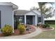 Charming single-story home with manicured landscaping and a welcoming front entrance, perfect for curb appeal at 9130 Laws Rd, Clermont, FL 34714