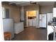 Garage featuring a washer and dryer, stand-up freezer, and plenty of storage space at 9130 Laws Rd, Clermont, FL 34714