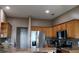 Bright kitchen featuring wooden cabinets, stainless steel appliances and granite countertops at 9130 Laws Rd, Clermont, FL 34714