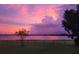 Stunning view of the lake at twilight, showcasing a picturesque landscape at 9130 Laws Rd, Clermont, FL 34714