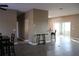 Open-concept living room with tile flooring and plenty of natural light, perfect for modern living at 9130 Laws Rd, Clermont, FL 34714