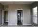 Spacious primary bedroom featuring neutral walls and two entrances to bathroom at 9130 Laws Rd, Clermont, FL 34714