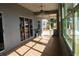 Sunlit porch featuring tile flooring, and lake view at 9130 Laws Rd, Clermont, FL 34714