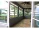 Inviting sun room filled with natural light and scenic lake views through large windows at 9130 Laws Rd, Clermont, FL 34714