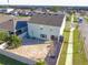 Aerial view of home showcases the private, fenced yard and brick patio with fire pit at 9228 Halsey Dr, Groveland, FL 34736